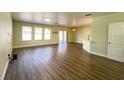 Spacious living room with hardwood floors, lots of light and an open floor plan at 2183 Leather Fern Dr, Ocoee, FL 34761