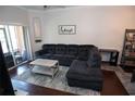 Cozy living room with a large sectional sofa, modern rug, and inviting atmosphere at 2241 Retreat View Cir, Sanford, FL 32771