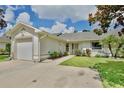 Inviting single-story home with a well-manicured lawn and a welcoming entrance at 3415 Celena Cir, St Cloud, FL 34769