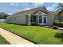Beautiful home with a lush green lawn and meticulous landscaping at 9003 Pecky Cypress Way, Orlando, FL 32836