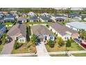 An aerial view of a single-story home with a well-manicured lawn in a residential neighborhood at 913 Sabal Breeze Ln, Apopka, FL 32703
