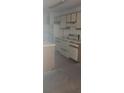 Functional kitchen featuring white appliances and ample cabinet space at 958 Salt Pond Pl # 103, Altamonte Springs, FL 32714
