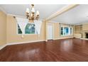 Spacious living room showcasing hardwood floors, crown molding and natural lighting at 1420 Rock Lake Dr, Orlando, FL 32805