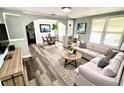 Staged living room with an open layout, modern decor, and comfortable seating at 2107 Hollywood Ave, Eustis, FL 32726