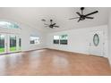 Bright, spacious living room with tile flooring, abundant windows, and stylish ceiling fans for ultimate comfort at 4085 Cypress Bend, Geneva, FL 32732