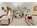 Bright living room featuring tile floors, vaulted ceilings, and neutral color scheme at 470 Cardinal Ct, Kissimmee, FL 34759