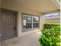 Inviting front porch with a window and a nicely painted door, providing a warm welcome at 512 Bella Rosa Cir, Sanford, FL 32771