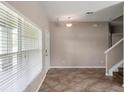 Bright living room with tiled floors, neutral paint and a large window with natural light at 512 Bella Rosa Cir, Sanford, FL 32771