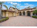 Lovely home with a three-car garage and brick-paved driveway at 5413 Via Veneto Ct, Sanford, FL 32771