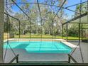 Inviting screened-in pool offers a private outdoor oasis for relaxation and recreation at 5489 Glen Oak Place, Sanford, FL 32771