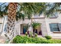 Charming townhome with a well-manicured garden and inviting entrance at 8806 Geneve Ct, Kissimmee, FL 34747