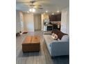 Cozy living room featuring stylish furniture, seamlessly connecting to the kitchen area at 1635 Wynford Cir, Tavares, FL 32778