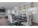 Elegant dining room with modern lighting, seating for six, and sliding glass doors to the patio at 1811 Caribbean View Ter, Kissimmee, FL 34747