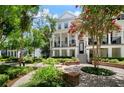 Charming townhouse featuring a beautiful exterior, lush landscaping, and a welcoming entrance at 2036 Brink Aly, Orlando, FL 32814