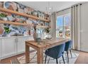 Bright office with a large window, accent wall shelving, and sleek furniture at 2273 Valentine Aly, Orlando, FL 32804