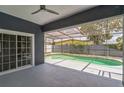 An inviting screened-in pool area offers a relaxing space for outdoor enjoyment and entertaining at 2604 Marble Ave, Orlando, FL 32803