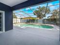 Inviting screened-in pool area offering a private outdoor oasis for relaxation and recreation at 2604 Marble Ave, Orlando, FL 32803