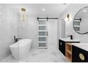 Modern bathroom features a freestanding tub, double vanities, and beautiful marble-look tile at 3 Pine Glen Dr, Debary, FL 32713