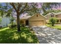 Charming single-Gathering home features a well-manicured lawn and a two-car garage at 30308 Cheval St, Mount Dora, FL 32757