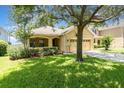 Well-maintained single-story home with lush green lawn and mature landscaping at 30308 Cheval St, Mount Dora, FL 32757