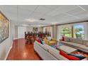 Spacious living room with ample seating and outdoor views of the yard at 690 Osceola Ave # 410, Winter Park, FL 32789