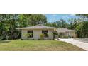 Inviting single-story home with a well-manicured lawn and beautiful landscaping, creating a warm and welcoming curb appeal at 917 Great Bend Rd, Altamonte Springs, FL 32714