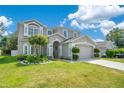 Beautiful home with lush landscaping and a well-maintained lawn at 9846 Palmetto Dunes Ct, Orlando, FL 32832