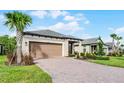Attractive single-Gathering home with a spacious garage and brick paved driveway at 1388 Lombardi Ct, Kissimmee, FL 34759