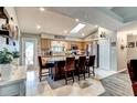 Bright kitchen features a central island with seating and modern stainless steel appliances at 680 Cheoy Lee Cir, Winter Springs, FL 32708