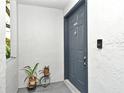 Charming front door of a condo with stylish decorations, modern hardware and a digital doorbell at 7104 Olympia Ct # 7104, Longwood, FL 32779