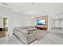 Open living area with stylish gray tile and a contemporary design aesthetic at 8713 Iron Mountain Trl, Windermere, FL 34786