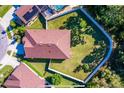 Aerial view of the home's fenced backyard and the surrounding neighborhood at 113 San Mardeen Ct, Daytona Beach, FL 32117
