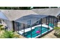 This screened-in pool has a paver deck and offers lots of room for entertaining at 1614 Oak Hill Trl, Kissimmee, FL 34747