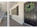 Inviting front porch with seating area, providing a relaxing outdoor space at 235 Ruth Blvd, Longwood, FL 32750