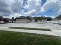 Charming home featuring a new paver driveway and sidewalk leading to the front entrance at 2420 Graham Dr, Orlando, FL 32807