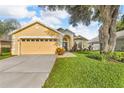 Charming single-story home featuring a well-maintained lawn and two car garage at 3196 Verbena Ct, Deltona, FL 32725