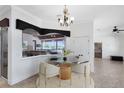Dinette area with modern lighting and direct access to outdoor kitchen and living area at 3201 Dallas Blvd, Orlando, FL 32833