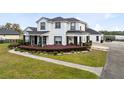 Elegant two-story home with manicured landscaping and paved walkway and driveway at 3201 Dallas Blvd, Orlando, FL 32833