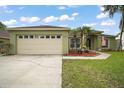 A well-maintained single-Gathering home with a two-car garage, lush lawn, and lovely landscaping at 3271 Settlers Trl, St Cloud, FL 34772