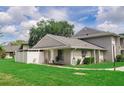 A bright and well-maintained home with a lush green lawn, crisp white fencing, and a cozy, welcoming exterior at 4438 Pinebark Ave # 4, Orlando, FL 32811