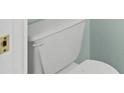An up close, partially obscured view of a standard white porcelain toilet at 660 Celebration Ave # 250, Kissimmee, FL 34747
