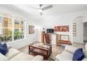 Inviting living room with modern decor, plenty of natural light and tile flooring at 860 N Orange Ave # 210, Orlando, FL 32801