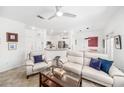 Cozy living room with tile flooring, white walls, and modern furniture at 860 N Orange Ave # 210, Orlando, FL 32801