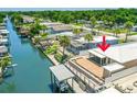 Aerial view of waterfront home with patio, screened-in porch, and dock with boat lift at 139 Douglas St, Edgewater, FL 32141
