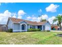 Inviting single-story home with manicured lawn and updated architectural details at 2375 Belen Dr, Deltona, FL 32738