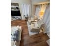 Comfortable living space with armchairs, neutral decor, and a cozy, inviting atmosphere at 6328 Raleigh St # 814, Orlando, FL 32835