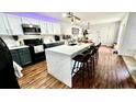 Modern kitchen featuring a spacious island with seating and sleek appliances at 12621 Tanja King Blvd, Orlando, FL 32828