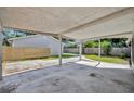 Spacious carport area offering covered parking and access to the home at 1308 Oregon St, Orlando, FL 32803