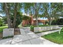 Charming curb appeal of a modern home featuring unique design elements and professional landscaping at 1742 Temple Dr, Winter Park, FL 32789