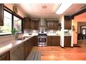 Beautiful kitchen with stainless steel appliances, ample storage, and hardwood floors at 2154 Lake Christie Dr, Orlando, FL 32809